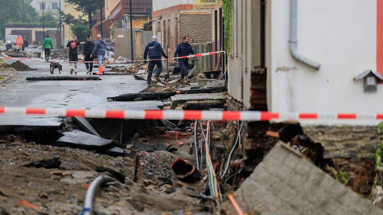 A view of the damage as people walk near the debris in the aftermath of flooding following heavy rainfalls, in Jesenik, Czech Republic.
Pic: Retuers