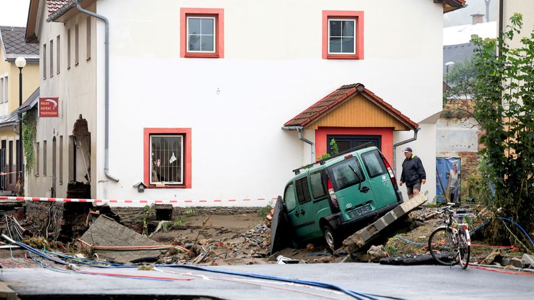 A man walks next to a damaged building, in the aftermath of flooding following heavy rainfalls, in Jesenik, Czech Republic.
Pic: Reuters