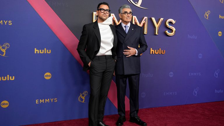 Dan Levy, left, and Eugene Levy arrive at the 76th Primetime Emmy Awards on Sunday, Sept. 15, 2024, at the Peacock Theater in Los Angeles. (AP Photo/Jae C. Hong)