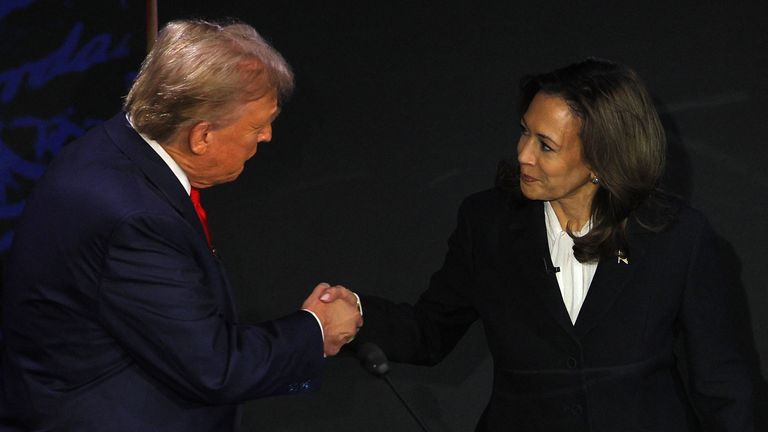 Kamala Harris goes for a handshake with Donald Trump at the start of the ABC debate. Pic: Reuters