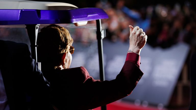 Elton John waves as he leaves the red carpet while at the premiere of 'Elton John: Never Too Late' at Roy Thomson Hall, during the Toronto International Film Festival, in Toronto, on Friday, Sept. 6, 2024. (Cole Burston/The Canadian Press via AP)