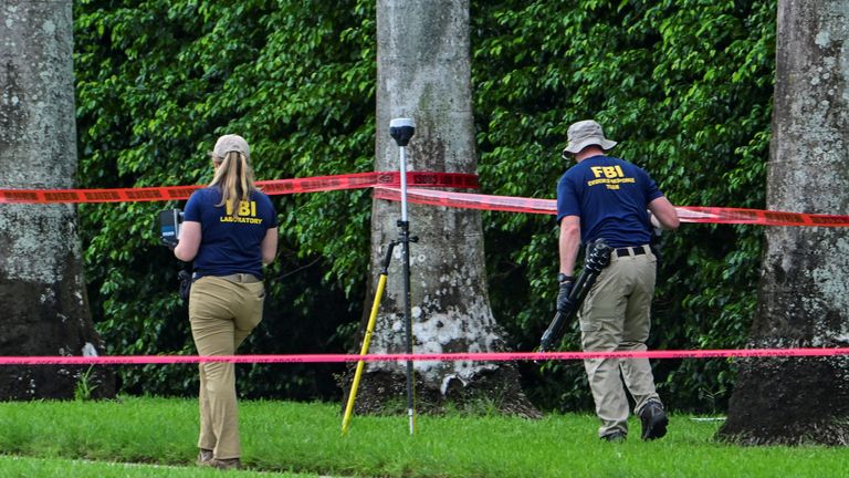 FBI officers investigate the area around Trump International Golf Club, following a suspected assassination attempt on Republican presidential candidate and former U.S. President Donald Trump, after a gunman was found at Trump's golf course, in West Palm Beach, Florida, U.S., September 16, 2024. REUTERS/Giorgio Viera