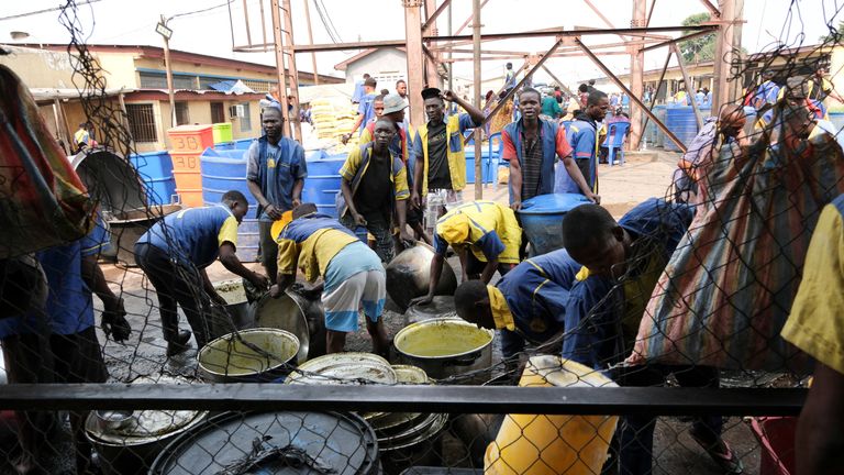 Prisoners clean pans and containers at Makala central prison
File pic: Reuters