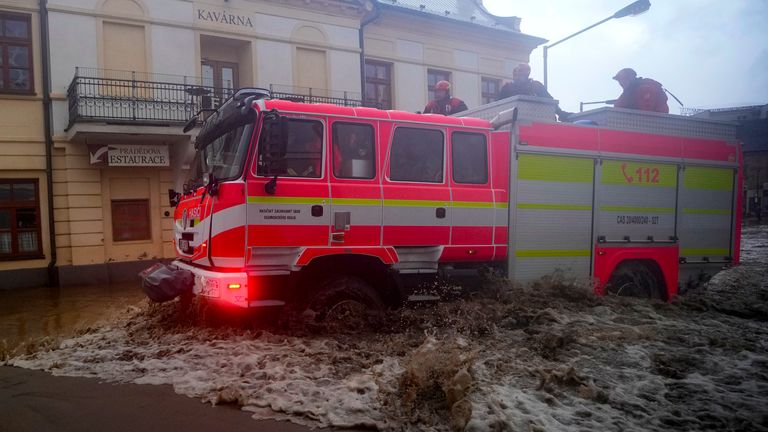 Firemen drive through flooded streets in Jesenik, Czech Republic. Pic: AP