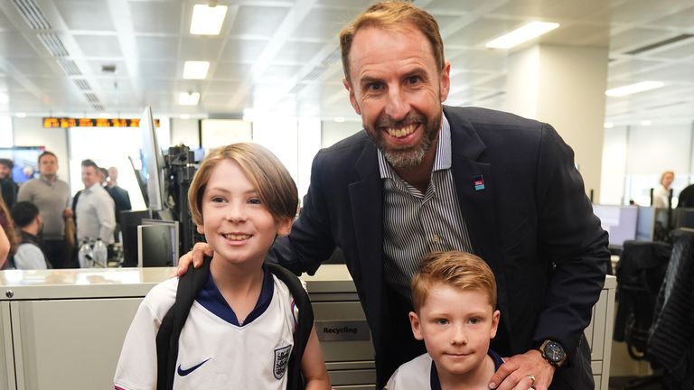 Gareth Southgate with young fans.
Pic: PA