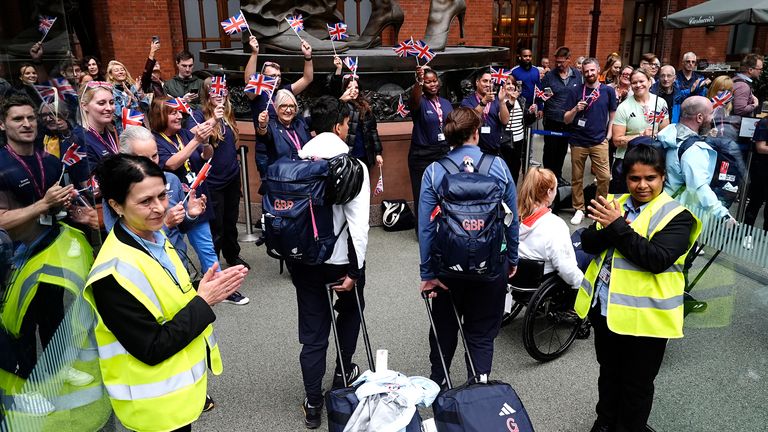 Members of Paralympics GB are applauded by staff after arriving by Eurostar into London St. Pancras International train station after competing at the 2024 Paris Paralympic Summer Games. 
Pic: PA