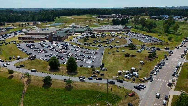 People leave Apalachee High School, Wednesday, Sept. 4, 2024, in Winder, Ga. (AP Photo/Mike Stewart)