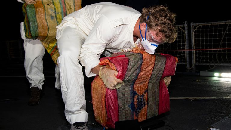 Seized cocacine from a narco-sub in the Caribbean Sea is weighed by a member of the crew aboard Royal Navy patrol ship HMS Trent.
Pic: MOD/Crown Copyright2024/LPhot Matt Bradley/PA