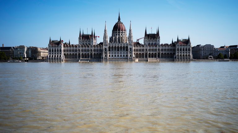 General view of the Parliament building as the Danube river floods its banks, central Budapest, Hungary, Thursday, Sept. 19, 2024. (AP Photo/Denes Erdos)