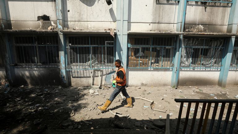 A Palestinian man walks on a street after a school, which was sheltering displaced people, was hit by an Israeli strike, amid the Israel-Hamas conflict, in Gaza City, September 21, 2024. REUTERS/Dawoud Abu Alkas