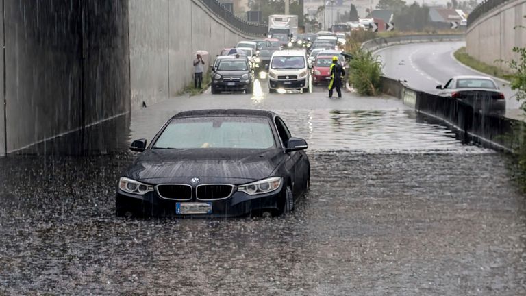 Cars are blocked in flooded streets in Milan, northern Italy, Thursday, Sept. 5, 2024. Lombardy and Veneto have been hit by widespread flooding, causing damage and disruption in the city of Milan, where the local Seveso and Lambro rivers overflowed. (Claudio Furlan/LaPresse via AP)