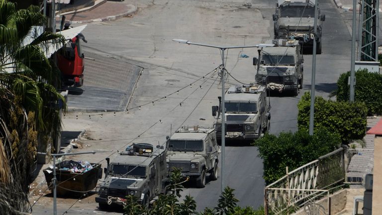 Israeli military vehicles maneuver during an operation in the West Bank city of Jenin, Thursday, Sept. 5, 2024. (AP Photo/Majdi Mohammed)