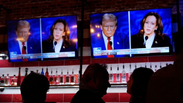 Viewers gather to watch a debate between Democratic presidential nominee Vice President Kamala Harris and Republican presidential nominee former President Donald Trump at the Angry Elephant Bar and Grill, Tuesday, Sept. 10, 2024, in San Antonio. (AP Photo/Eric Gay)