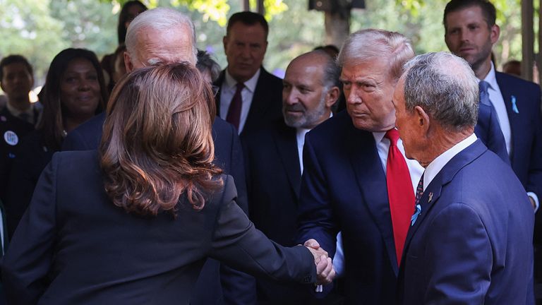 Republican presidential nominee and former U.S. President Donald Trump shakes hands with Democratic presidential nominee and Vice President Kamala Harris on the day of a ceremony marking the 23rd anniversary of the September 11, 2001 attacks on the World Trade Center at the 9/11 Memorial and Museum in the Manhattan borough of New York City, U.S., September 11, 2024. REUTERS/Mike Segar