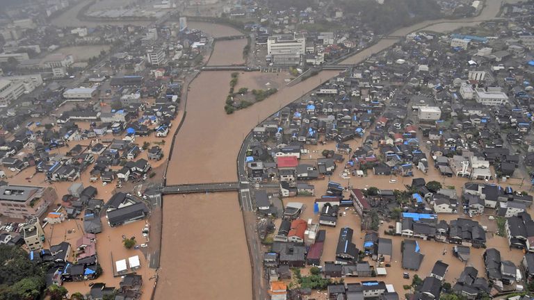 This aerial photo shows the flooded Kawarada river and submerged area after heavy rain in Wajima, Ishikawa prefecture, Saturday, Sept. 21, 2024. (Kyodo News via AP)