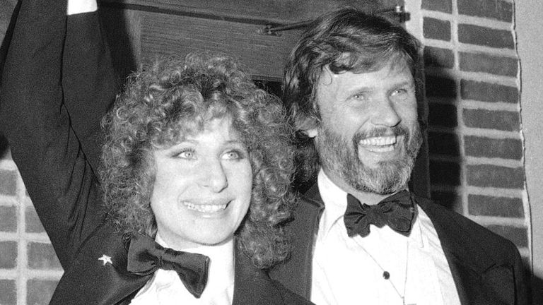 FILE - In this Dec. 23, 1976 file photo, producer Jon Peters, from left, Barbra Streisand and Kris Kristofferson appear at a  preview of the film, "A Star is Born," in New York. Streisand is giving an early thumbs-up to the remake of ...A Star Is Born... with Lady Gaga and Bradley Cooper. Streisand and Kristofferson topped the 1976 version of the romantic drama about a rising performer and a fading star.  (AP Photo/Suzanne Vlamis, File)