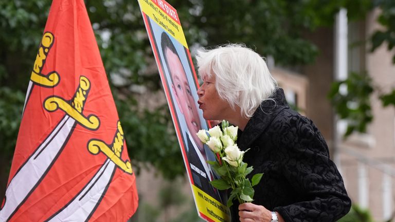 Melanie Leahy, whose 20-year-old son, Matthew, died in November 2012 while a patient at the Linden Centre mental health facility in Chelmsford, kisses a picture of him outside the Lampard Inquiry.
Pic: PA