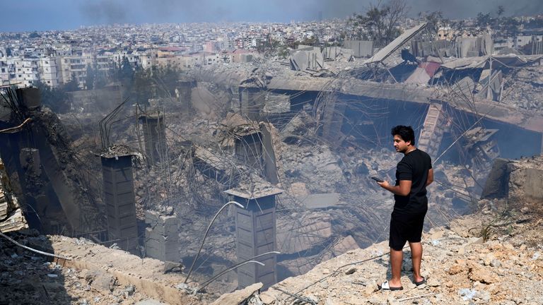 A man checks a damaged building at the site of an Israeli airstrike in Choueifat, south east of Beirut on Saturday. Pic: AP