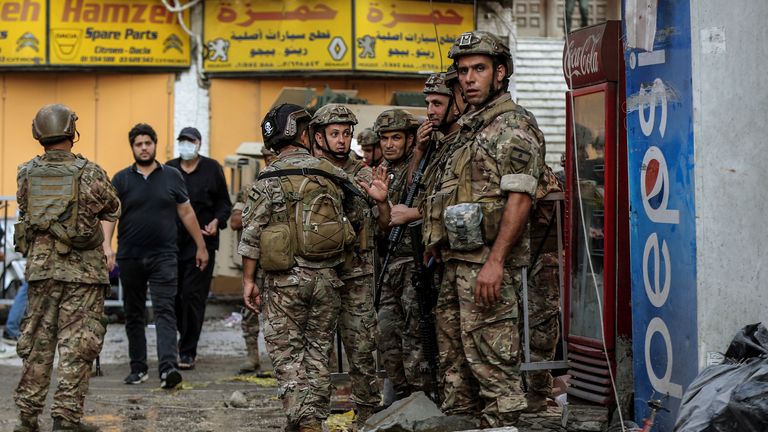 Lebanese soldiers at a building hit by an Israeli airstrike in Beirut. Pic: AP