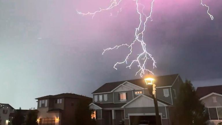 Lightning strikes over a house in Utah