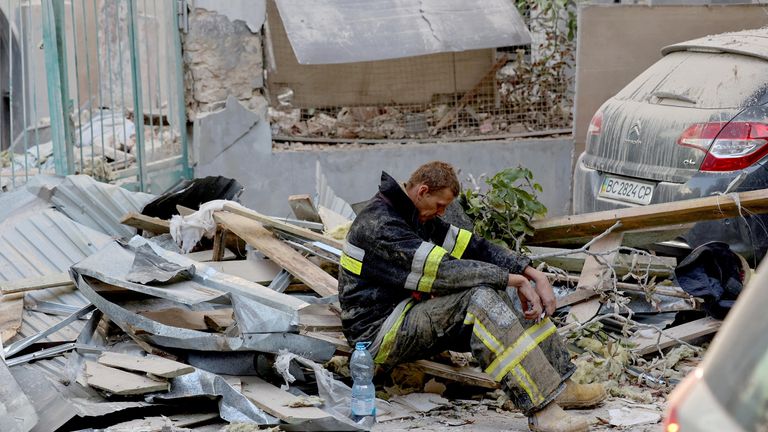 A rescuer rests at the site of a Russian drone and missile strike on residential buildings, amid Russia's attack on Ukraine, in Lviv, Ukraine September 4, 2024. REUTERS/Roman Baluk     TPX IMAGES OF THE DAY     