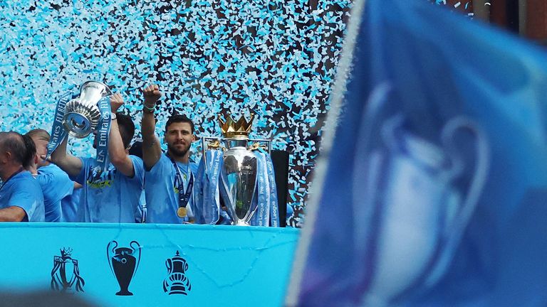 Soccer Football - Manchester City Victory Parade - Manchester, Britain - June 12, 2023 Manchester City's Ruben Dias celebrates with the Premier League trophy during the parade REUTERS/Carl Recine