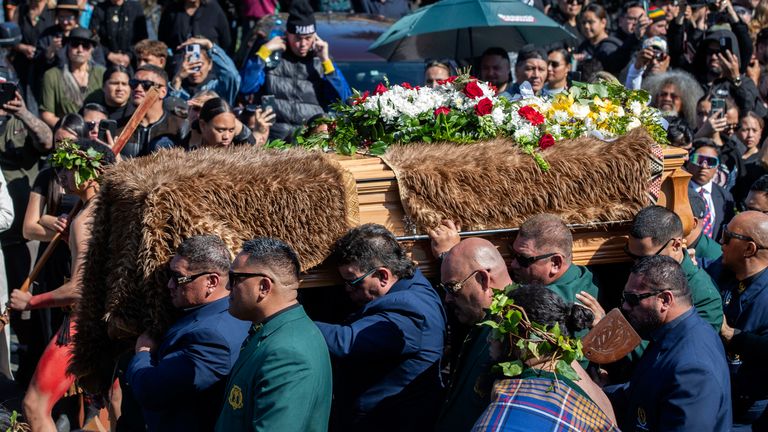 The coffin with the body of New Zealand's Maori King, Kiingi Tuheitia Pootatau Te Wherowhero VII, is carried up Taupiri Mountain for burial in Ngaruawahia, New Zealand, Thursday, Sept. 5, 2024. (AP Photo/Alan Gibson)