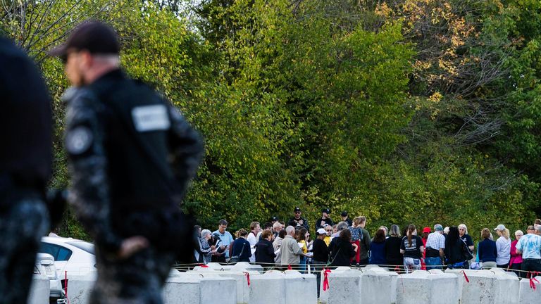 Missouri Department Corrections officers patrol the area as protesters opposing the execution of Marcellus Williams pray outside the state prison, Tuesday, Sept. 24, 2024, in Bonne Terre, Missouri. (Zachary Linhares/St. Louis Post-Dispatch via AP)