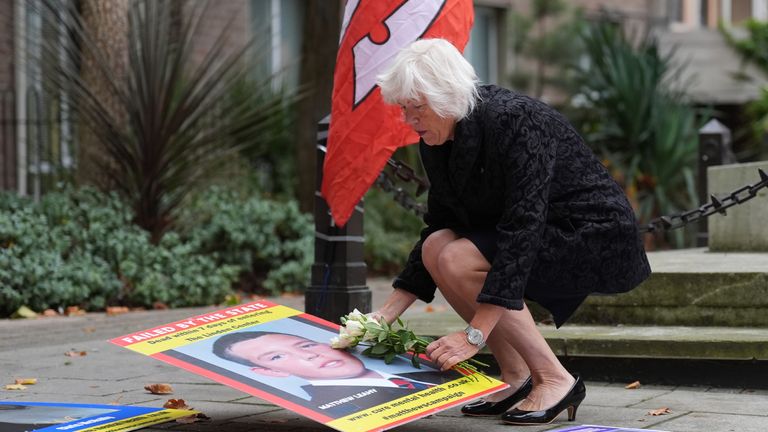 Melanie Leahy, whose 20-year-old son, Matthew, died in November 2012 while a patient at the Linden Centre mental health facility in Chelmsford, lays some flowers and a picture of him outside the Lampard Inquiry.
Pic: PA