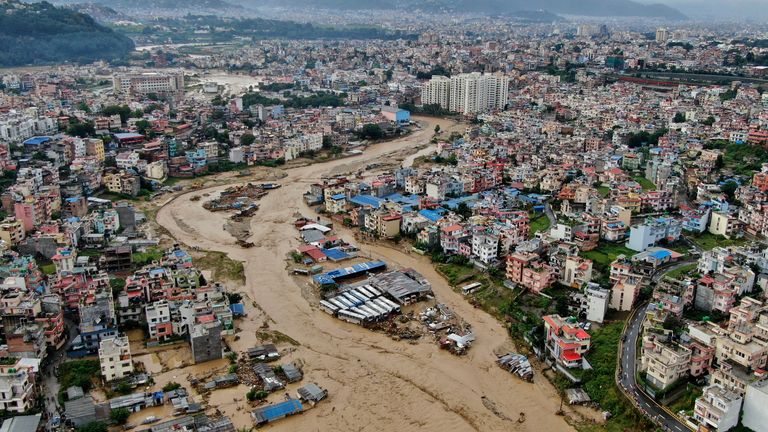 In this aerial image of the Kathmandu valley, Bagmati River is seen in flood due to heavy rains in Kathmandu, Nepal, Saturday, Sept. 28, 2024. (AP Photo/Gopen Rai)