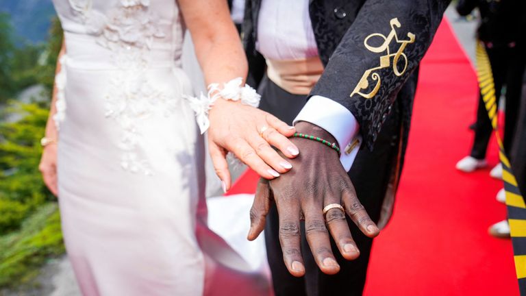 Norway's Princess Martha Louise and Durek Verrett show their rings on the day of their wedding party in Geiranger, Norway August 31, 2024. NTB/Heiko Junge/via REUTERS ATTENTION EDITORS - THIS IMAGE WAS PROVIDED BY A THIRD PARTY. NORWAY OUT. NO COMMERCIAL OR EDITORIAL SALES IN NORWAY.