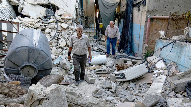 A Palestinian man inspects the damage to a building after Israeli forces raided the West Bank city of Jenin.
Pic: AP