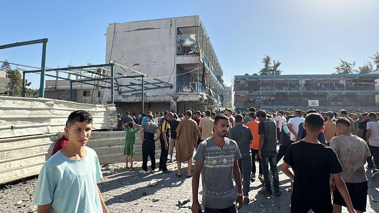 Palestinians inspect a school sheltering displaced people, after it was hit by an Israeli strike in Gaza's Nuseirat.
Pic: Reuters