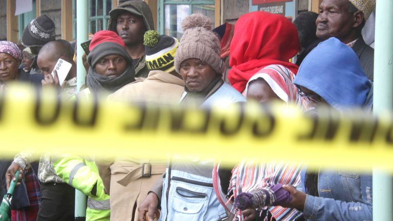 Parents stand near the burnt-out dormitory, following a fire at the Hillside Endarasha Primary in Nyeri, Kenya.
Pic: AP