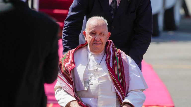 Pope Francis wearing a Tais, East Timor's traditional scarf. Pic: AP