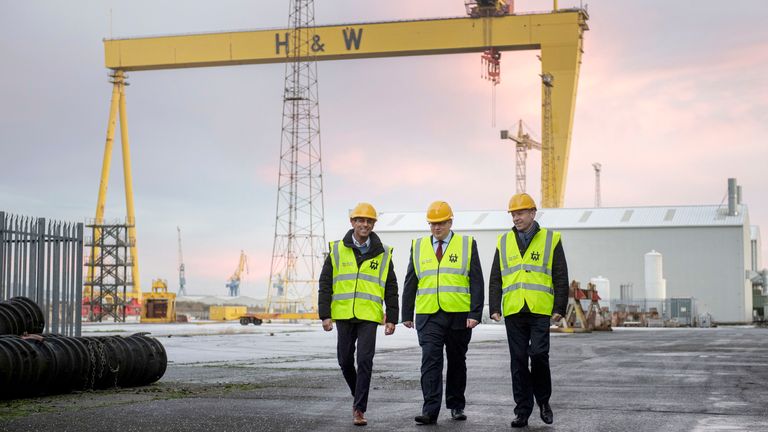 Rishi Sunak, left, visits the Harland & Wolff shipyard factory accompanied by Northern Ireland Secretary of State Chris Heaton-Harris, right, and H&W CEO John Wood in Belfast.
Pic: AP