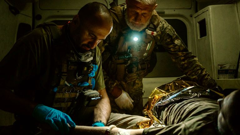 Yaroslav giving first aid in the ambulance. Pic: Alex Rossi