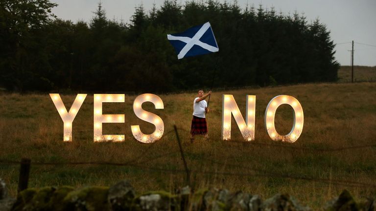 Previously unreleased photo dated 15/09/14 of businessman Jon Gamble from go2eventhire as he asks the question YES or NO with illuminated signs near Dunblane, Scotland, ahead of voting in the Scottish Referendum on September 18th.