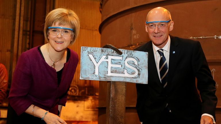 Deputy First Minister Nicola Sturgeon and Finance Secretary John Swinney with a steel 'Yes' sign at Steel Engineering in Renfrew, Scotland ahead of the Scottish independence referendum on Thursday.