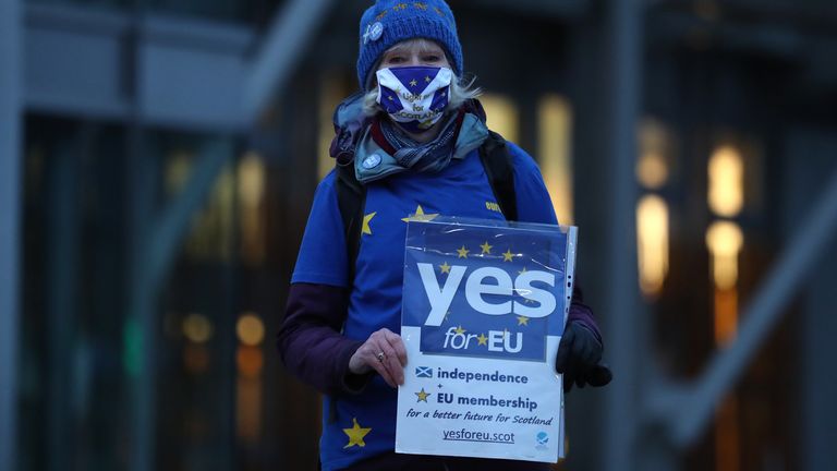 Supporters of the campaign group Yes for EU outside the Scottish Parliament at Holyrood in Edinburgh as they protest against Brexit.