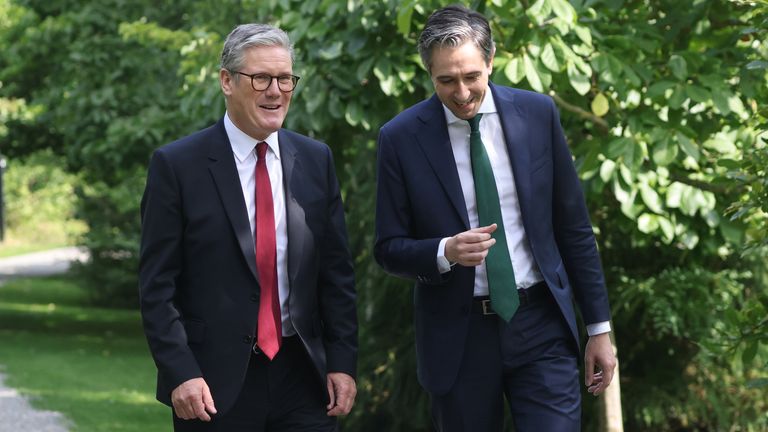 The two leaders walk in the grounds of Farmleigh House, the official Irish state guest house in Dublin. Pic: PA