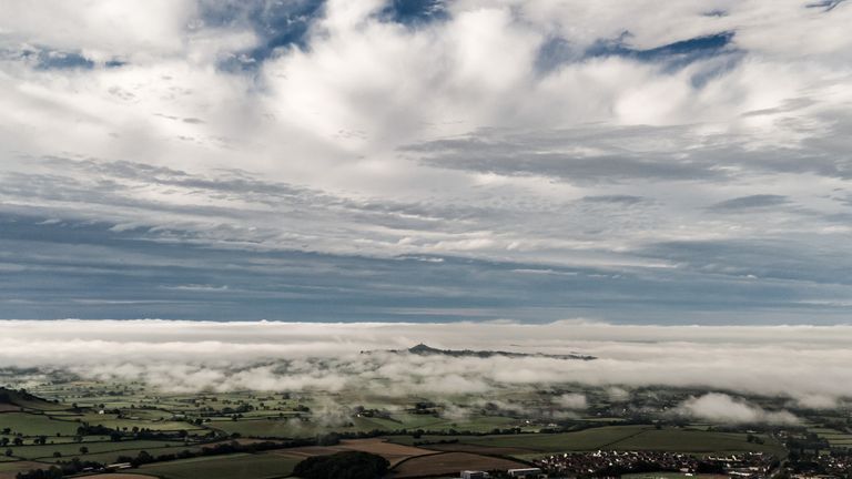 Clouds and mist form over Somerset after heavy rain on Saturday. Pic: PA