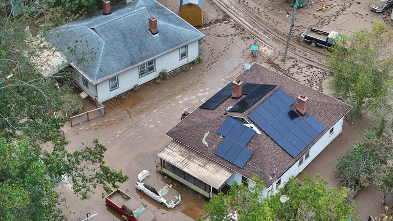 A drone view shows houses in a damaged area, following the passing of Hurricane Helene, in Swannanoa, North Carolina, U.S., September 29, 2024. REUTERS/Marco Bello