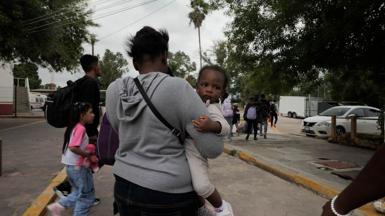 A GROUP OF MIGRANTS ARE LED FROM MEXICO TO THE US 2