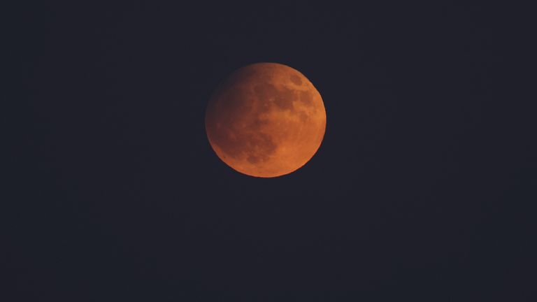 The supermoon can be seen over Los Angeles. Image: Reuters