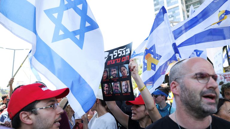 Protesters rally together outside the defence ministry in Tel Aviv on Monday. Pic: Reuters