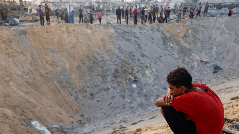 A Palestinian boy looks on at the site following Israeli strikes on a tent camp sheltering displaced people, amid the Israel-Hamas conflict, at the Al-Mawasi area in Khan Younis, in the southern Gaza Strip, September 10, 2024. REUTERS/Mohammed Salem