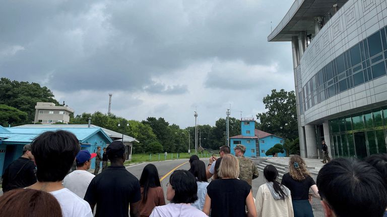 Travis King, in the black T-shirt and black cap, is pictured on the civilian tour. Pic: Reuters 