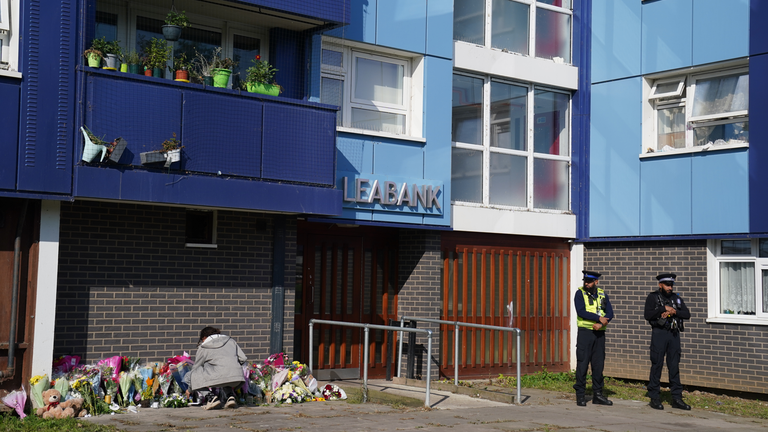 Tributes were left outside Leabank, Luton, as police remained at the scene over the weekend. Pic: PA