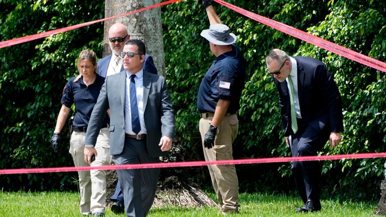 Law enforcement officials work outside of the Trump International Golf Club after the apparent assassination attempt of Republican presidential nominee and former President Donald Trump Monday, Sept. 16, 2024, in West Palm Beach, Fla. (AP Photo/Lynne Sladky)